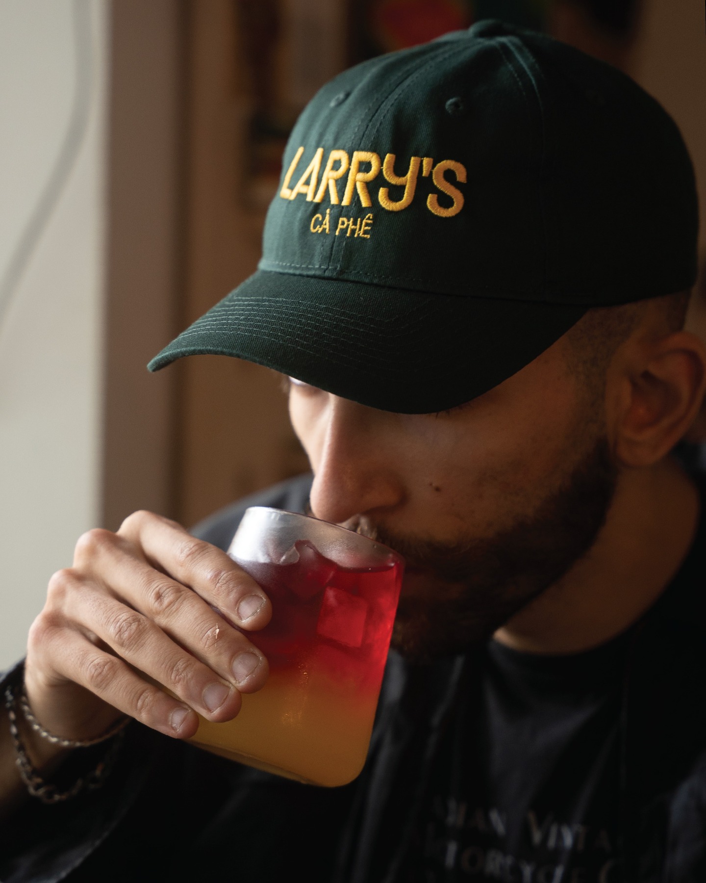 Larrys merch green and yellow hat front photo